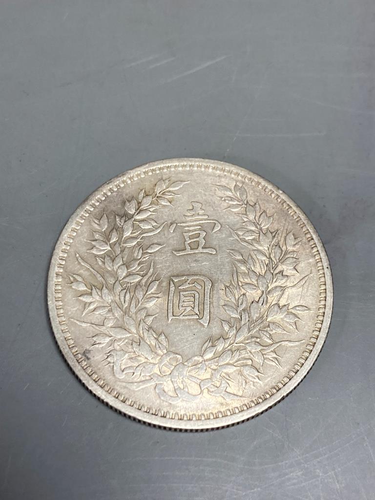 Two USA silver dollars, 1883 and 1903, a Chinese 1914 silver dollar, sundry Chinese and Taiwanese coins, etc.